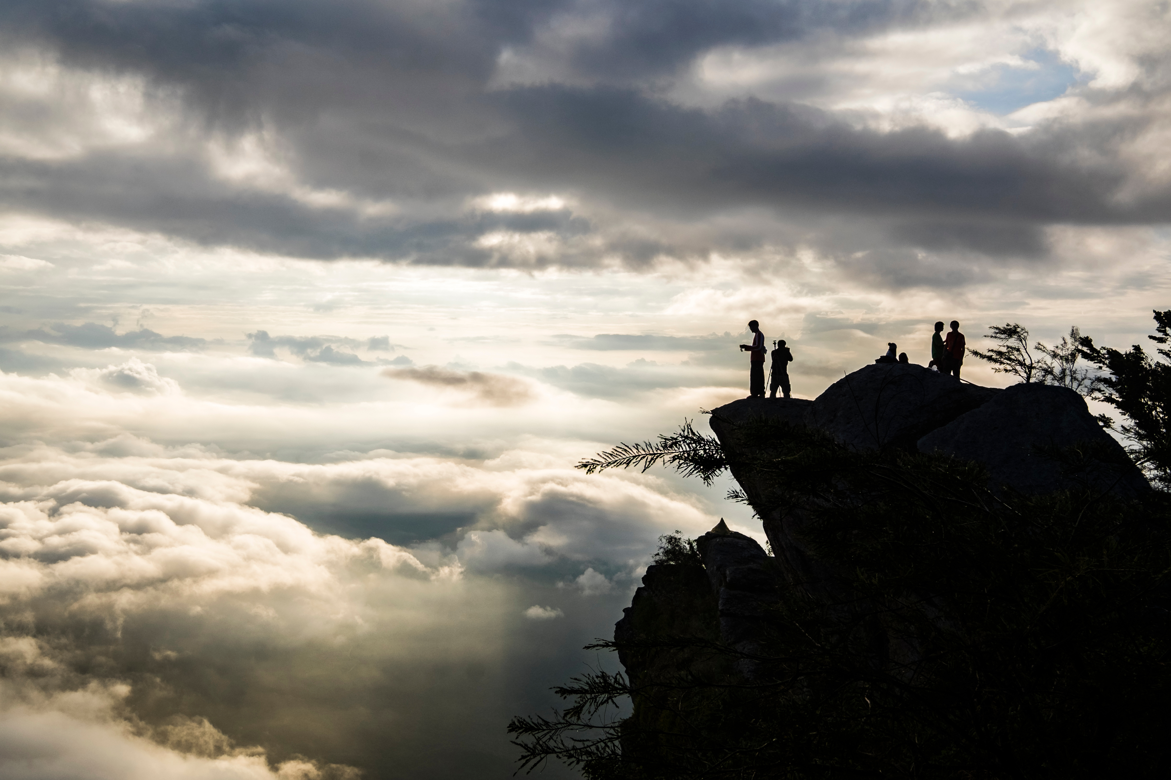People standing at the edge of a cliff